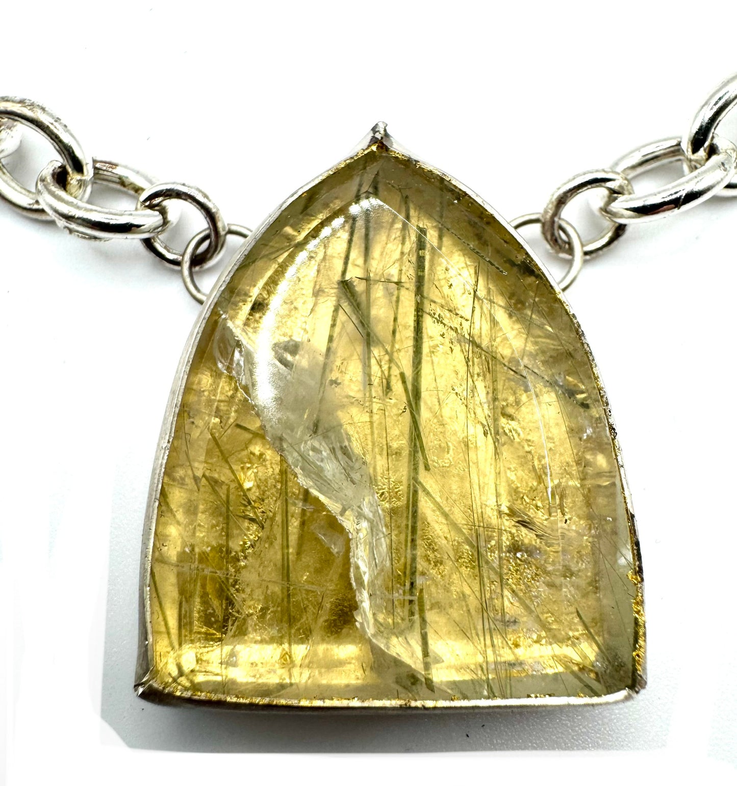 Medusa’s Undoing in Sterling silver and 23k Gold Leaf with Rutilated green quartz