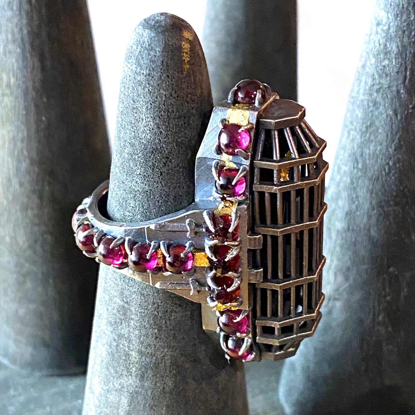 Carthusian’s Soul Carved Black Coral Monk Figure Iron Maiden Ring in Sterling Silver With Garnets and 23kt Gold leaf