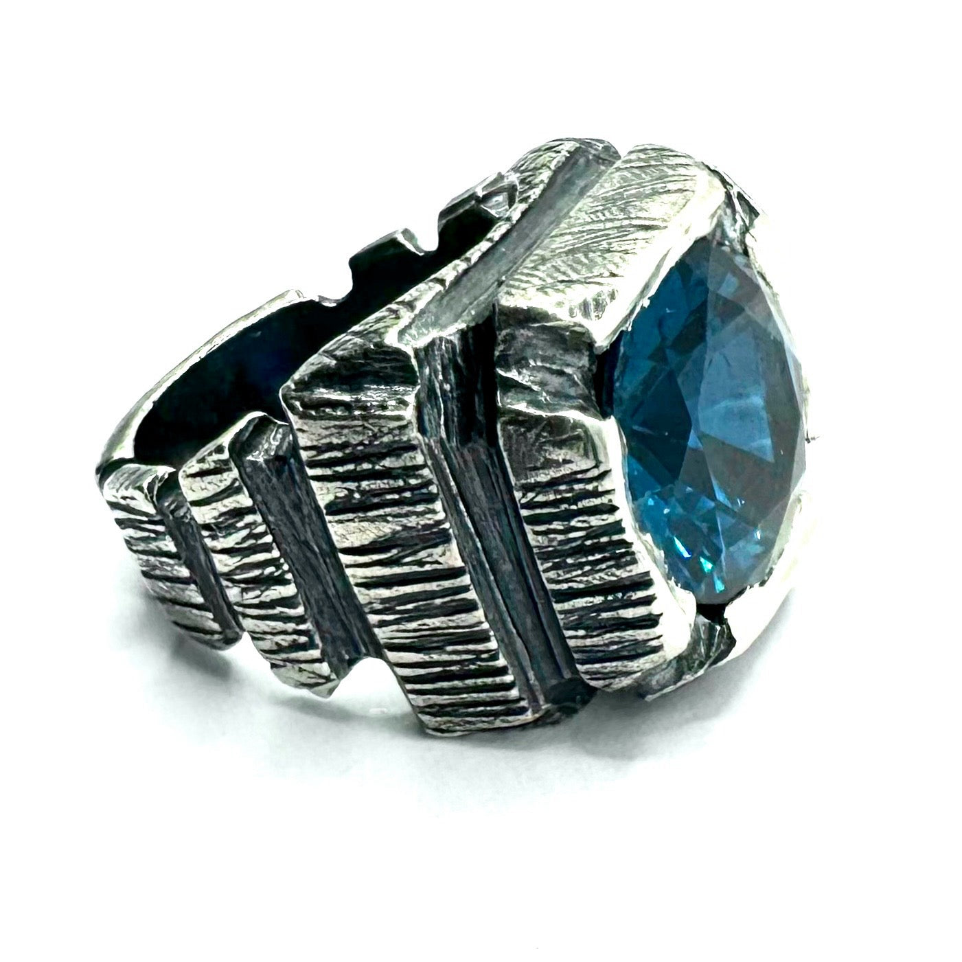 Ring of Shifting Light Set with Blue Color Changing Spinel in Sterling Silver