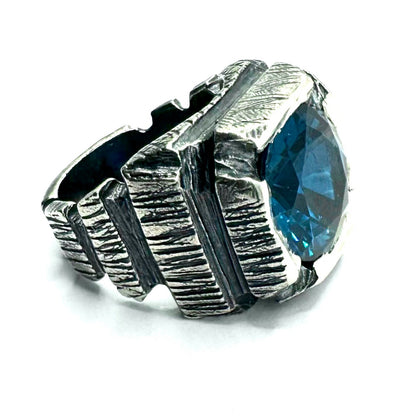 Ring of Shifting Light Set with Blue Color Changing Spinel in Sterling Silver